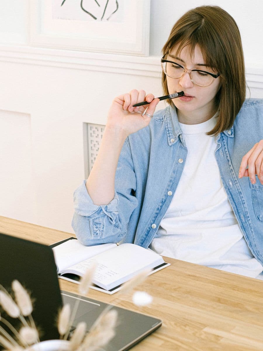 A freelance consultant working at a laptop in a home office